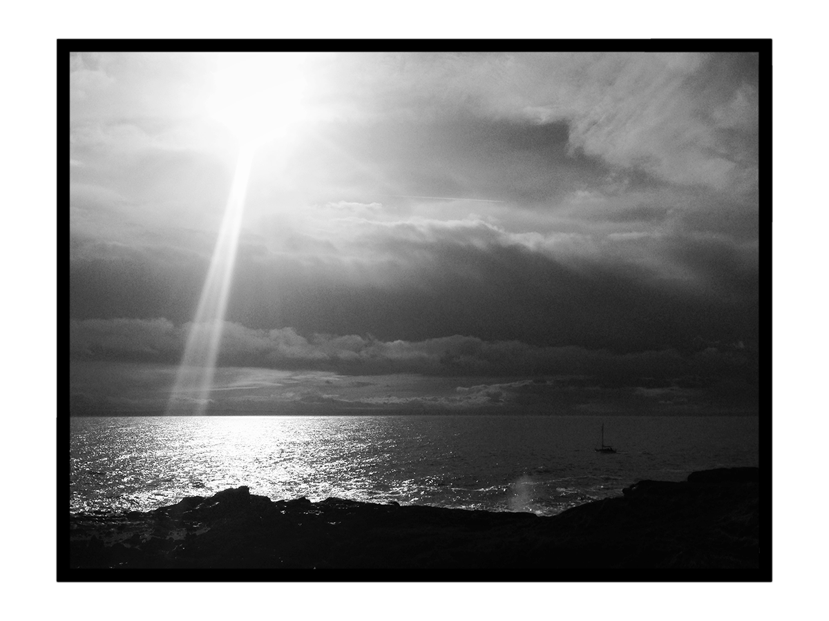black and white scottish sea with sun